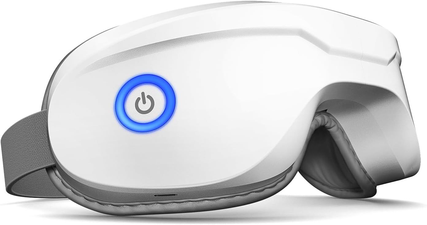 White eye massager with adjustable strap and illuminated power button on the side.